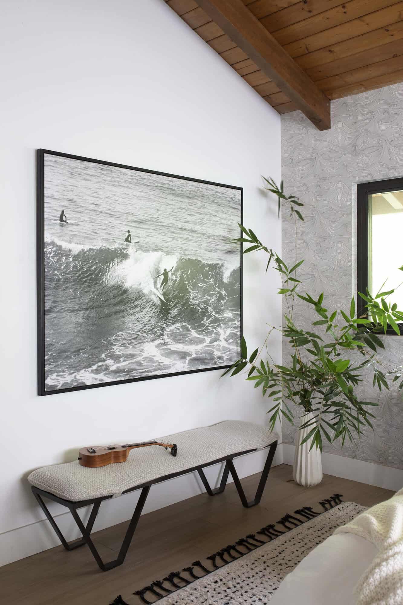 bohemian style bedroom with a bench and wall art