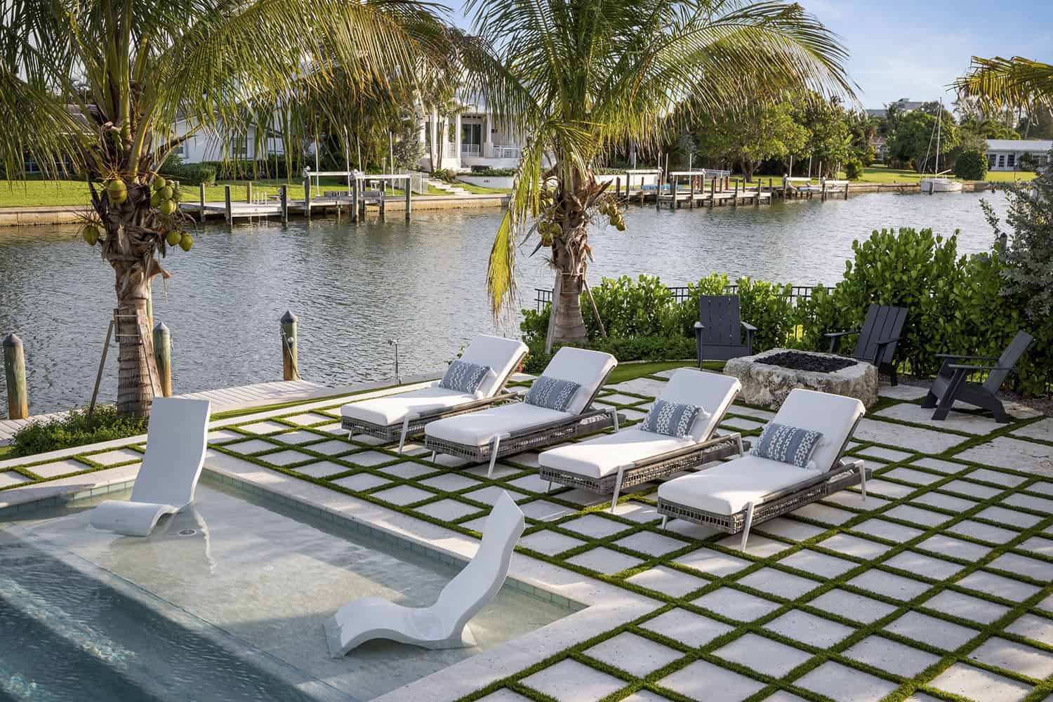 contemporary coastal patio with sun loungers