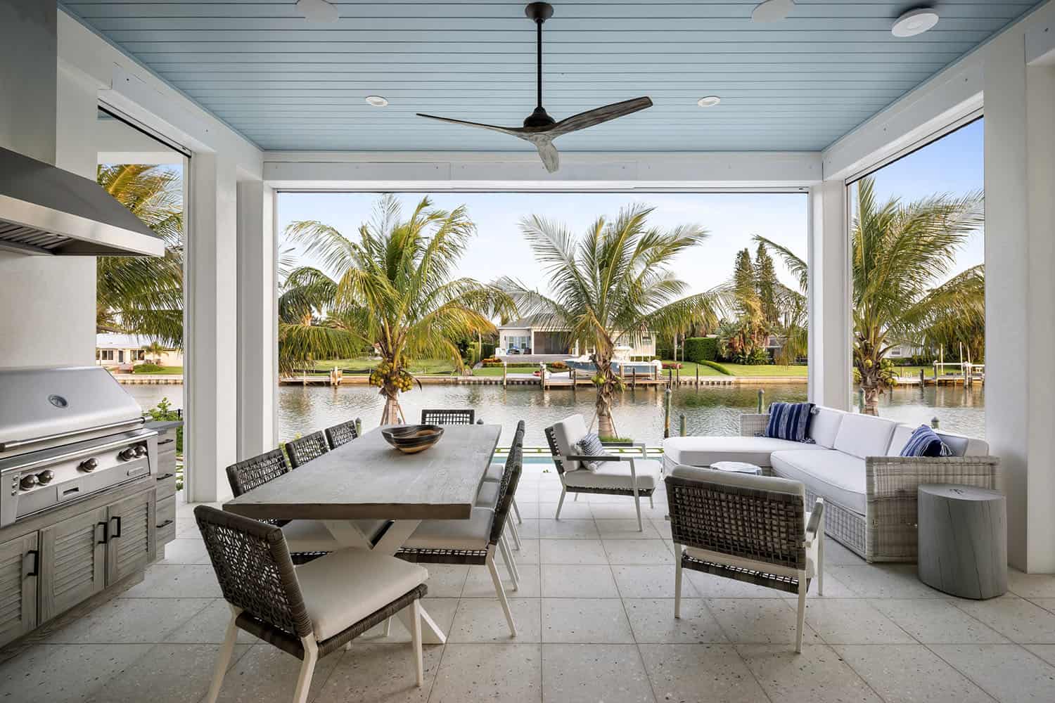 coastal contemporary covered patio with living and dining area