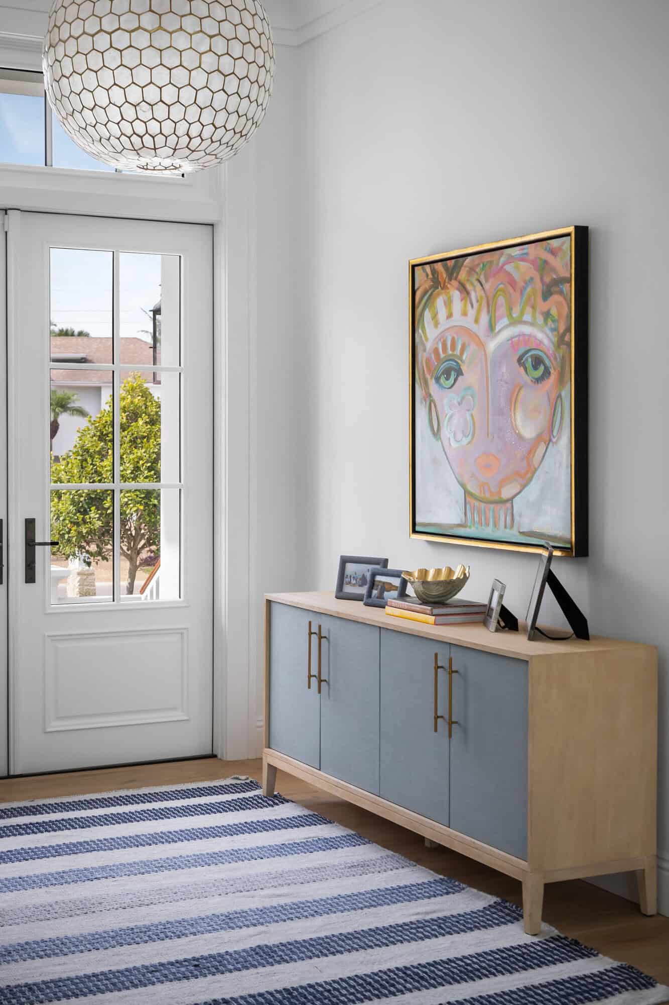 contemporary coastal home entry with a console table