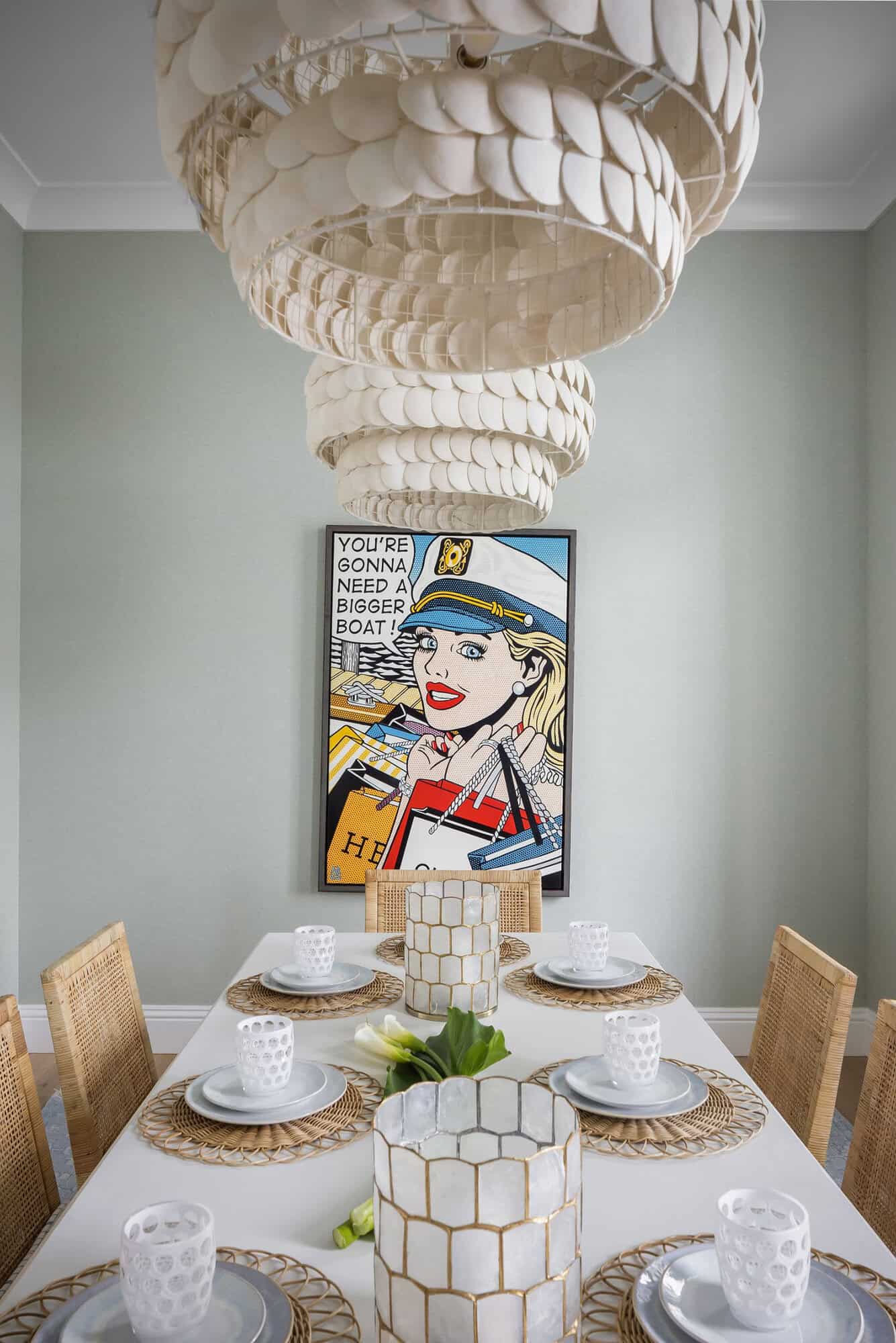 contemporary coastal dining room with artwork