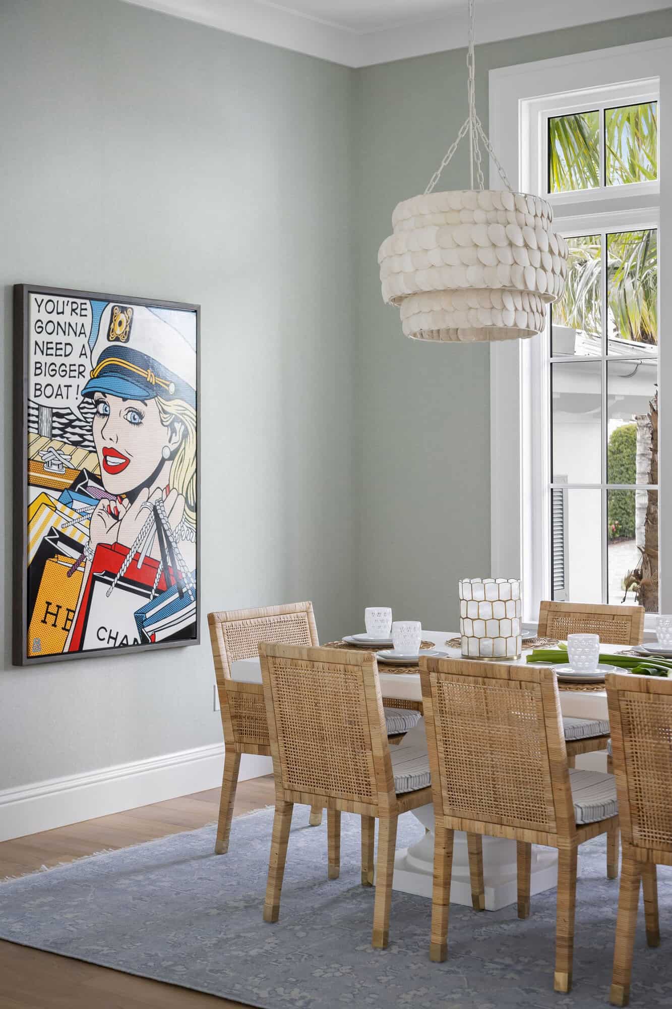 contemporary coastal dining room with artwork