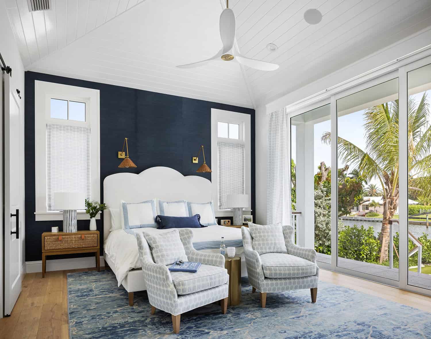 contemporary coastal bedroom with a black accent wall