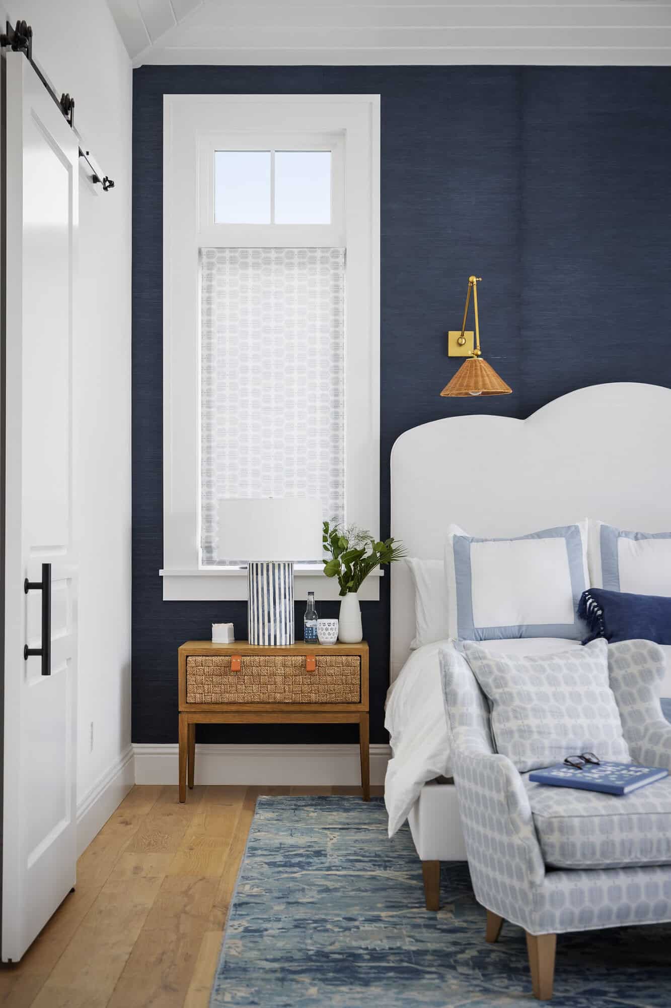 contemporary coastal bedroom with a black accent wall