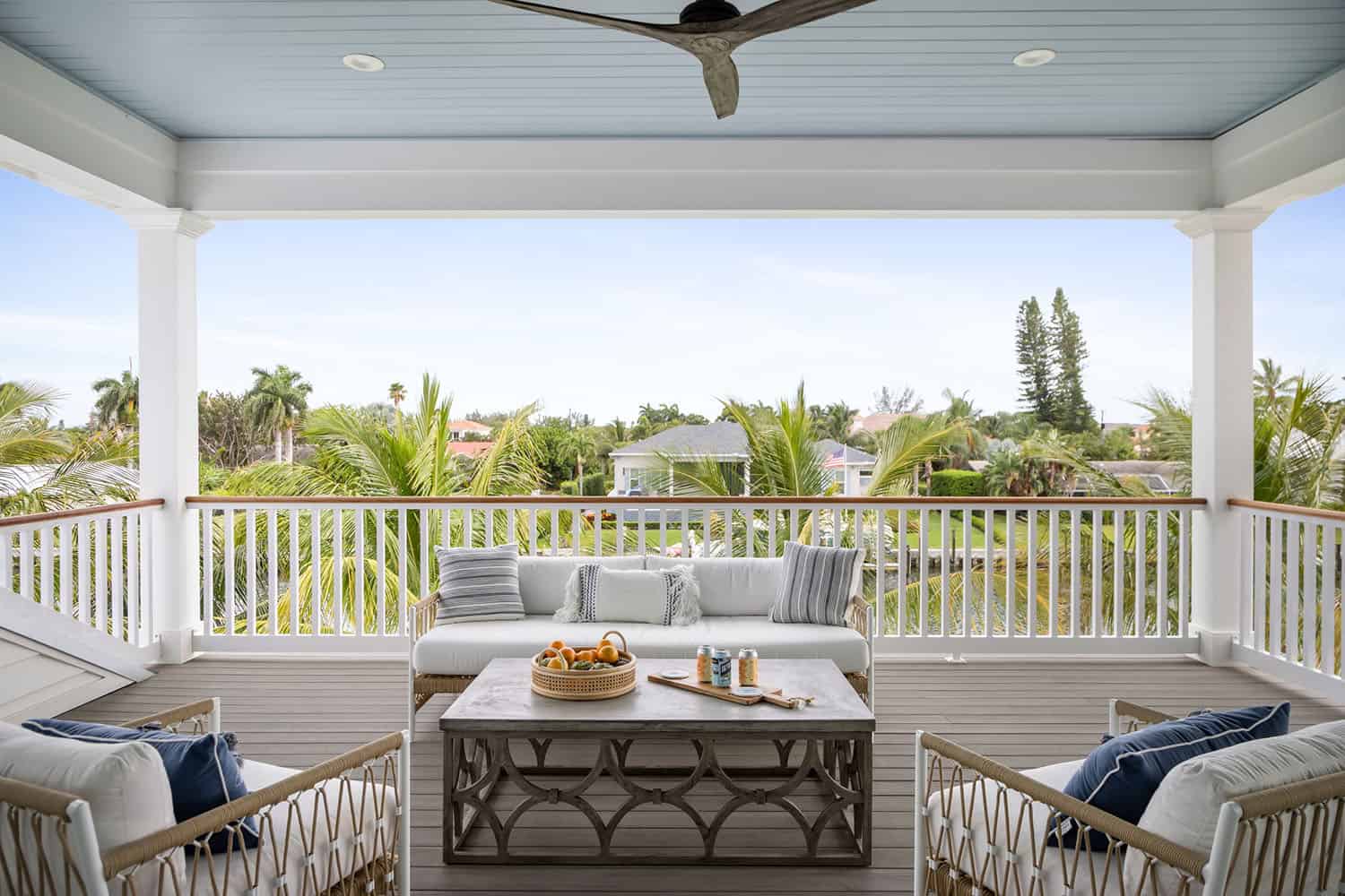 contemporary coastal covered deck with outdoor furniture