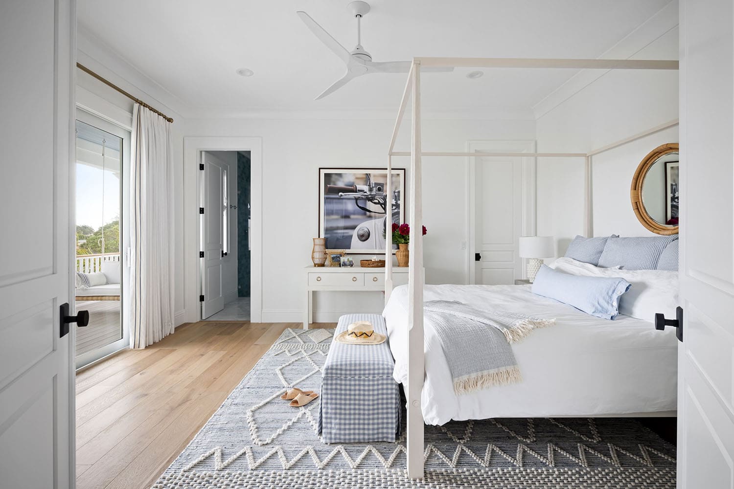 contemporary coastal bedroom with a canopy bed