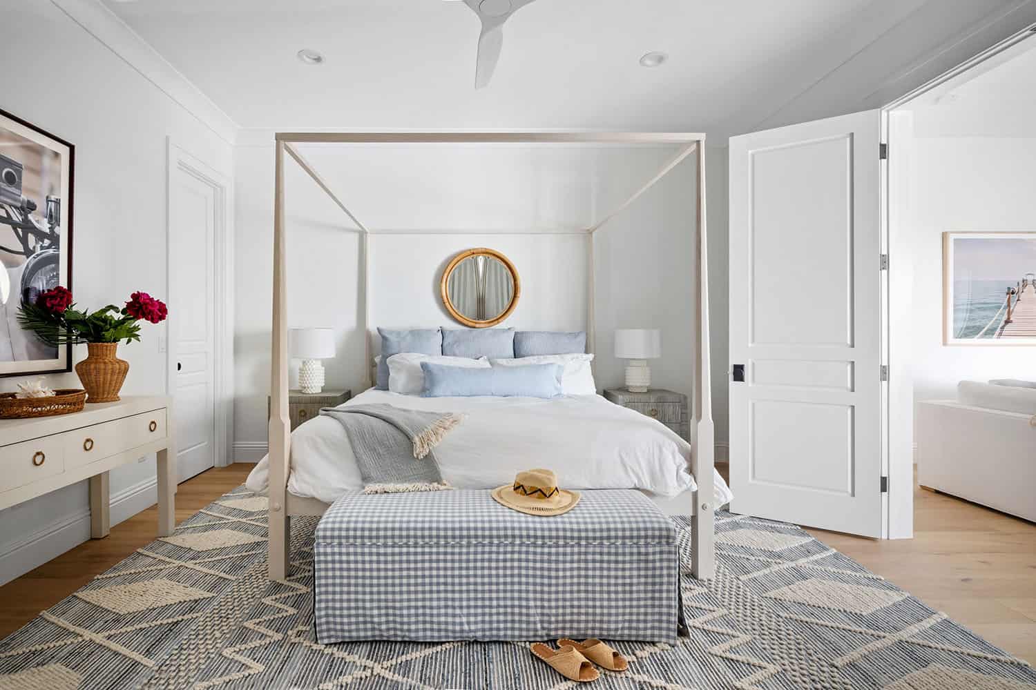 contemporary coastal bedroom with a canopy bed