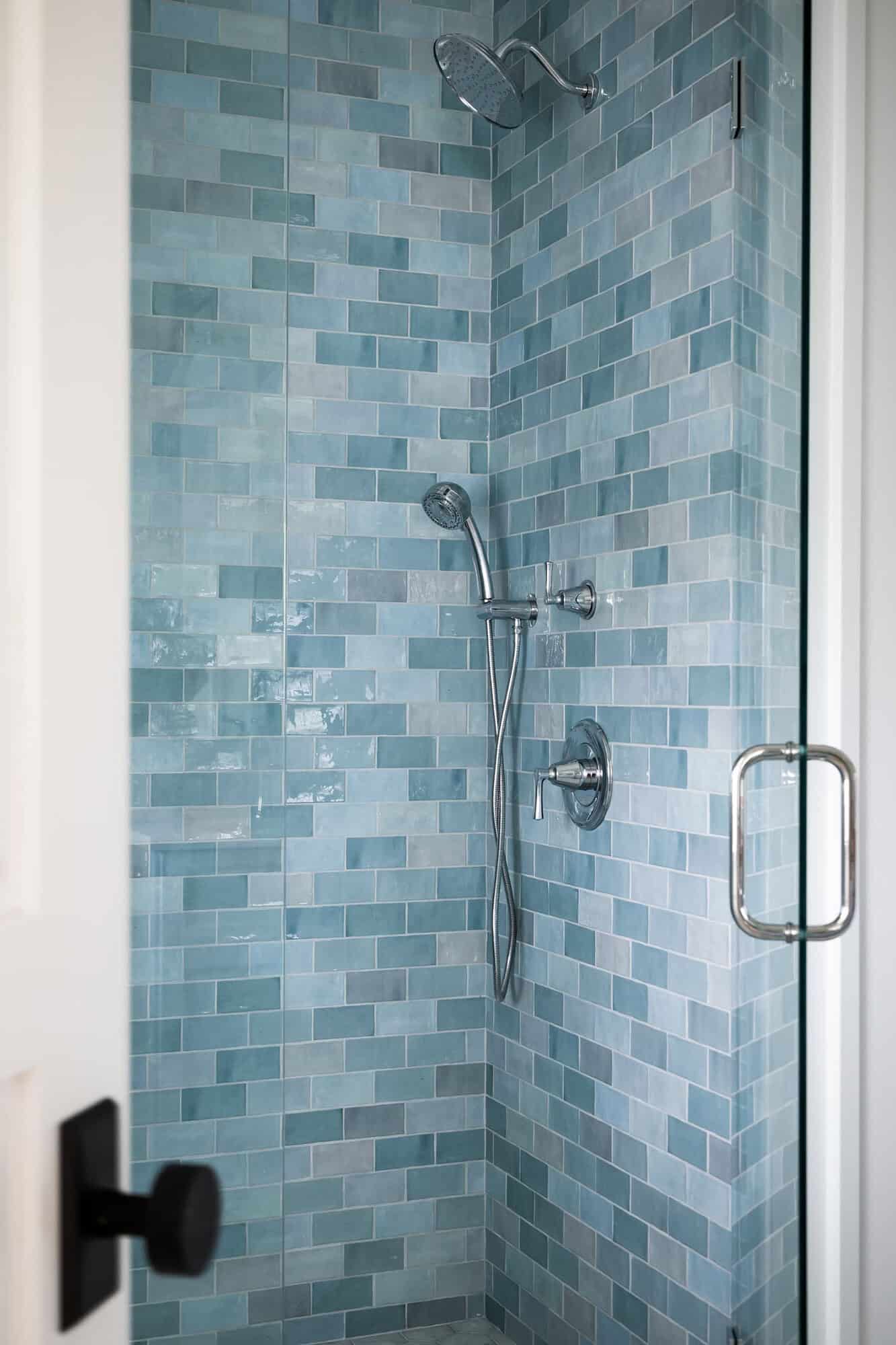 contemporary coastal bathroom shower with blue wall tile