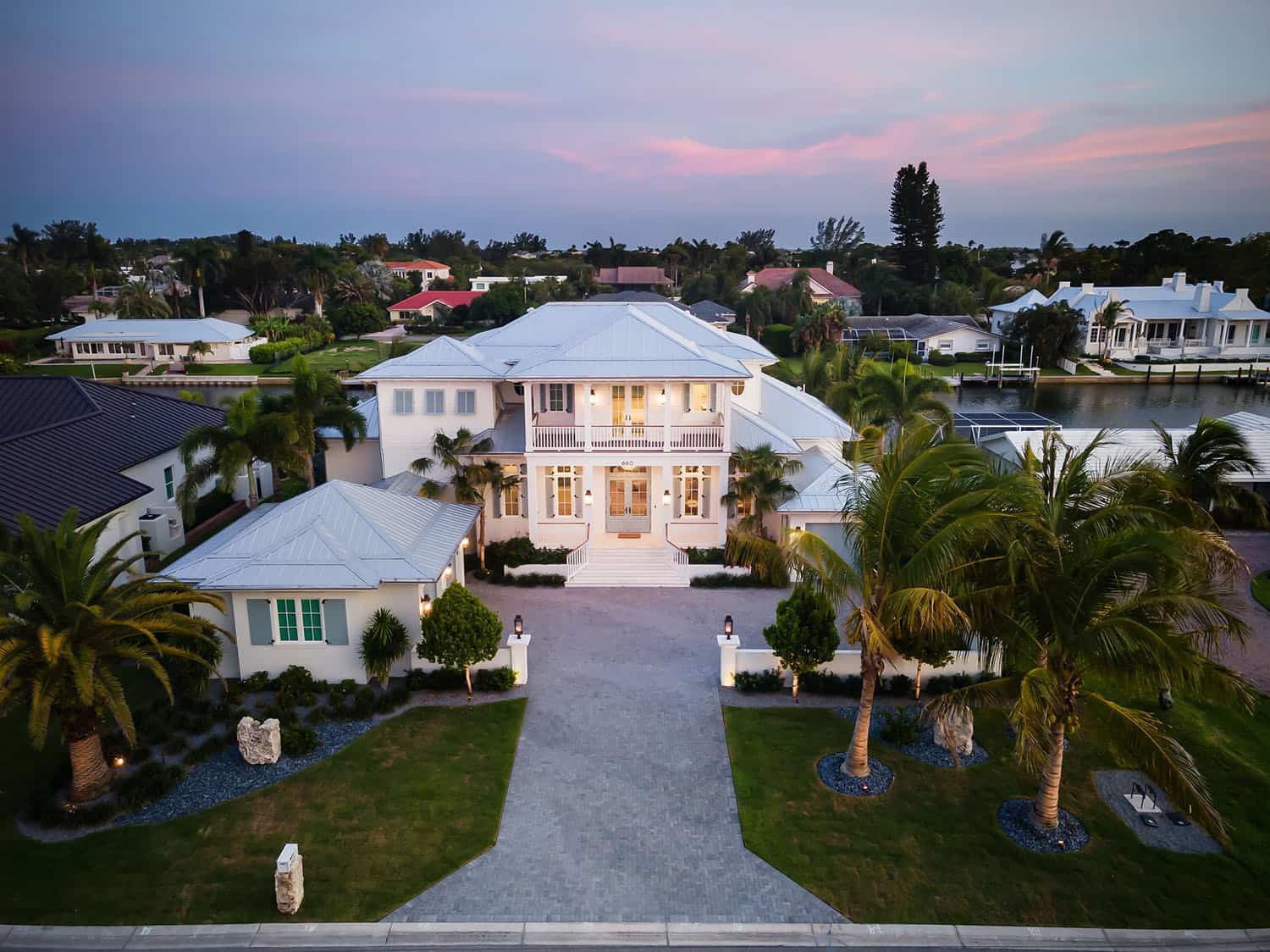 contemporary coastal home exterior at dusk