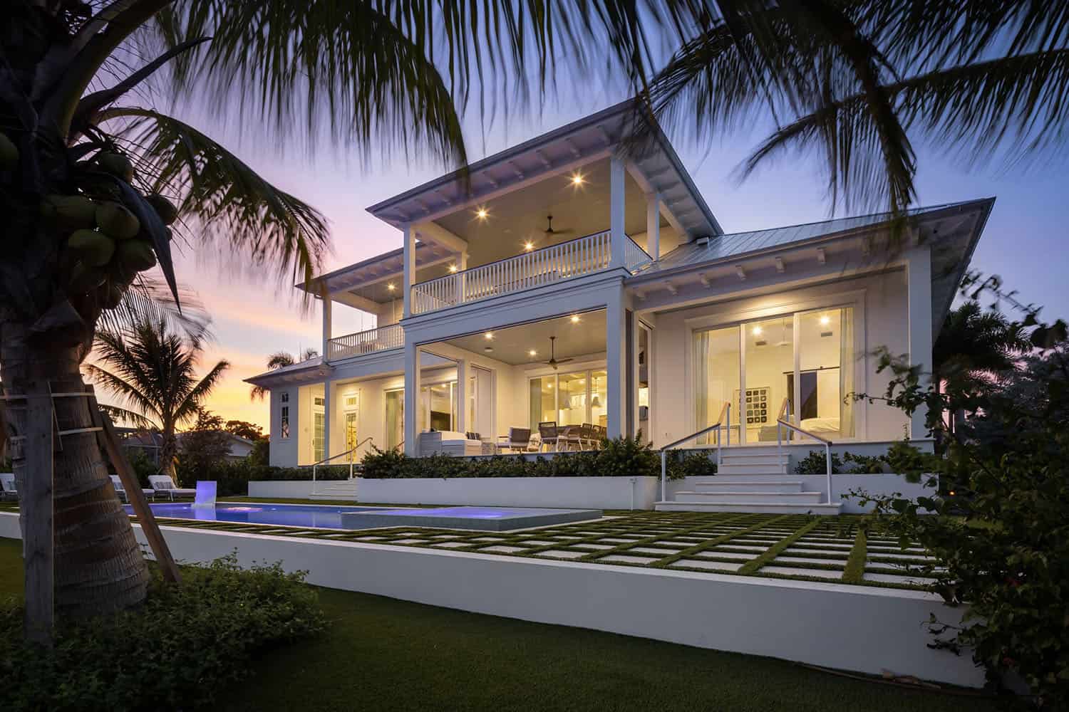 contemporary coastal home exterior at dusk