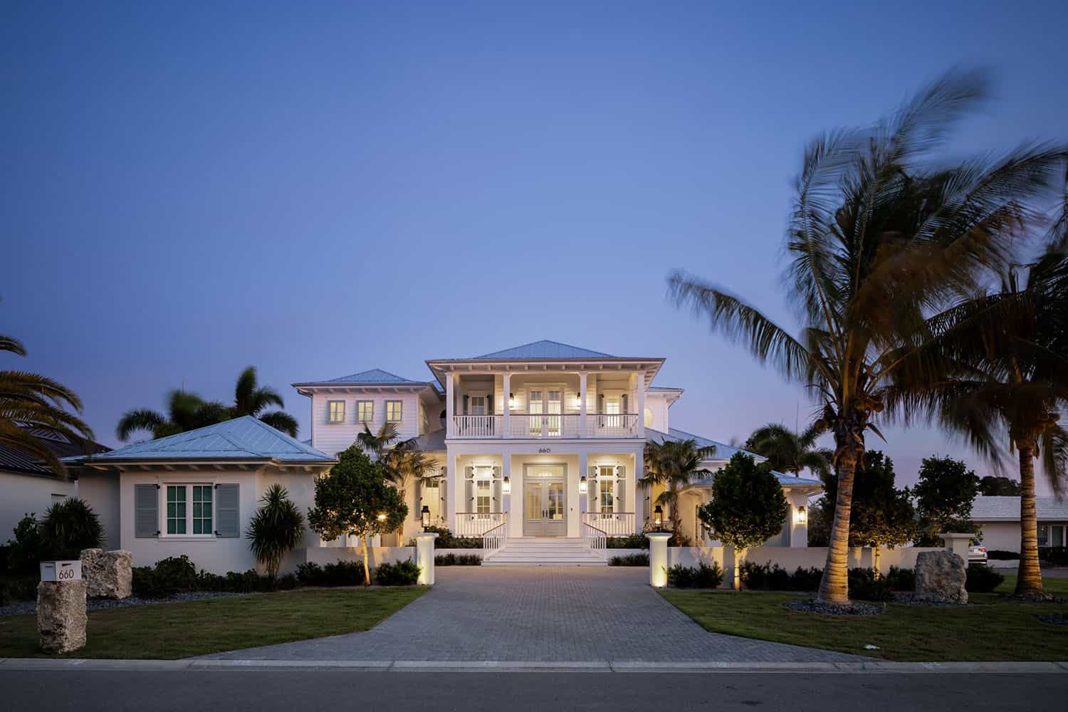 contemporary coastal home exterior at dusk