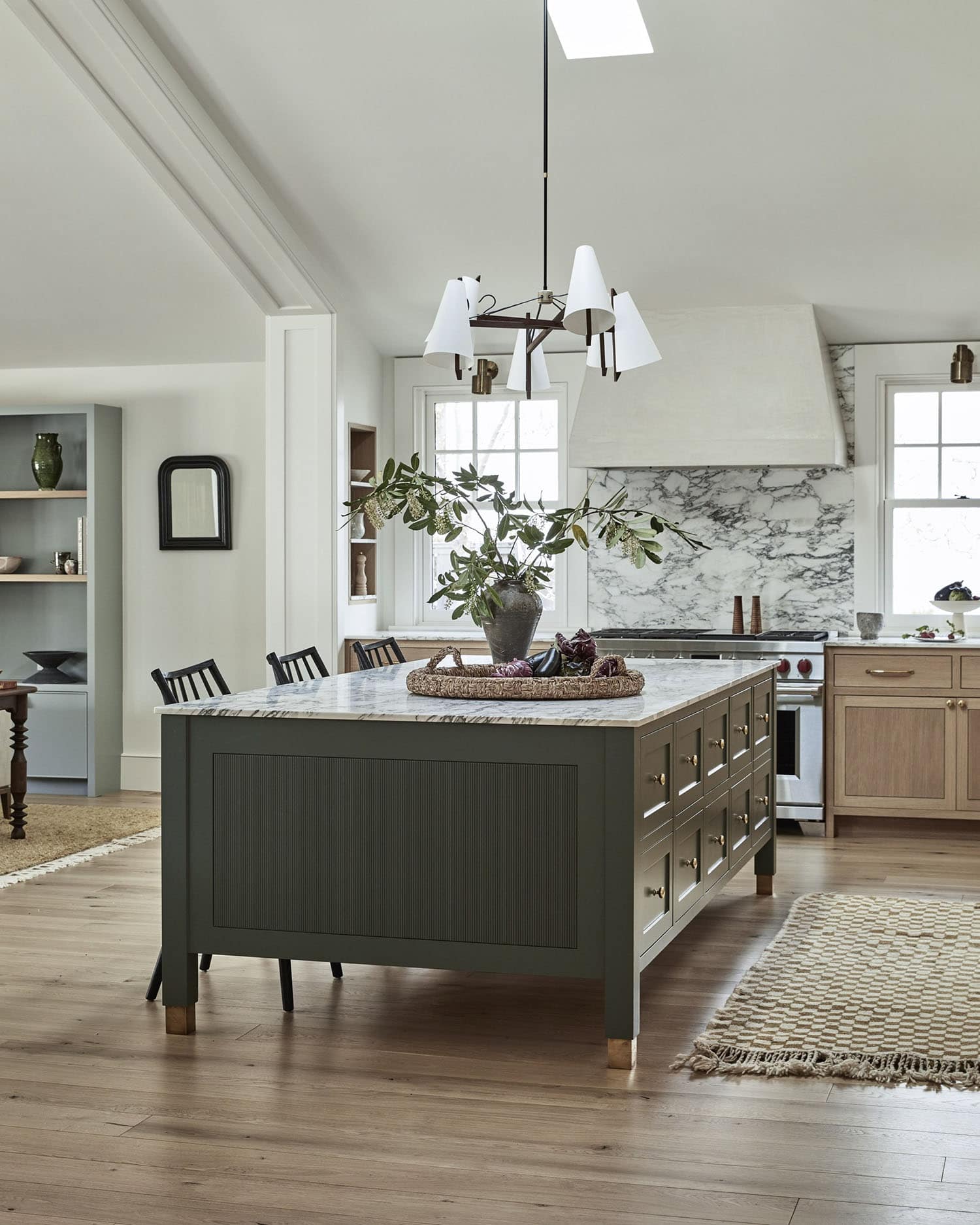 contemporary kitchen with a large green island