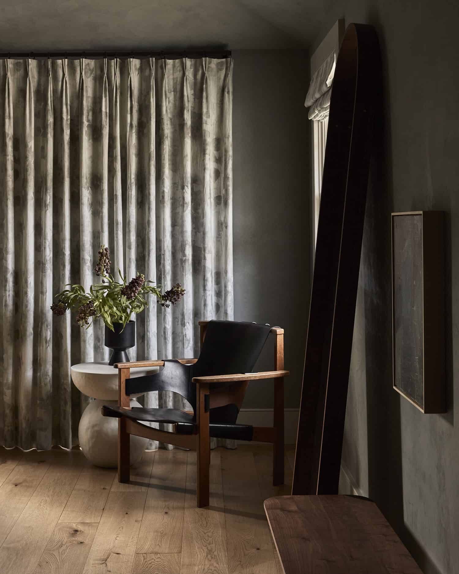 contemporary bedroom with a corner reading chair