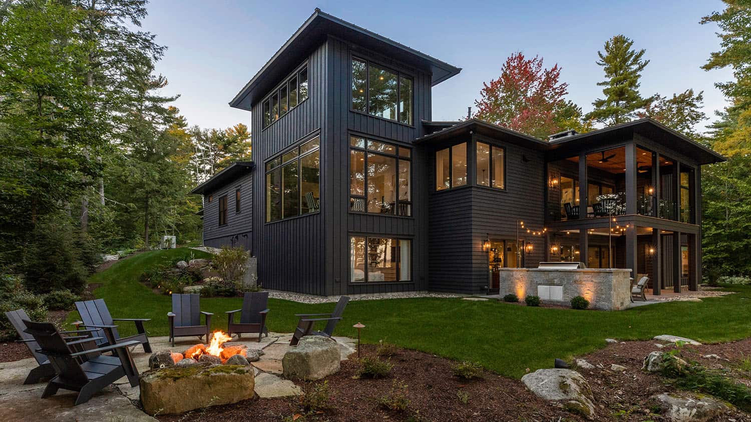 contemporary prairie style home exterior with a fire pit