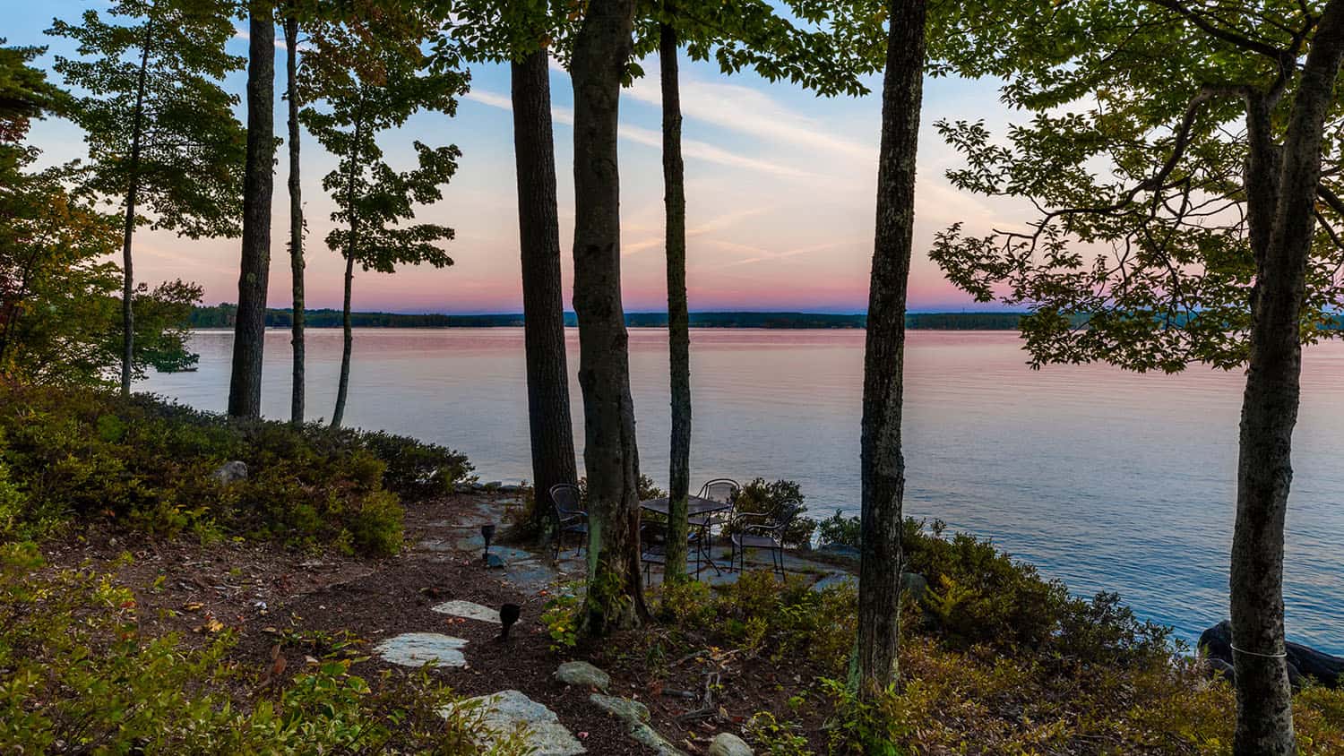 contemporary prairie style home exterior with a view of the lake