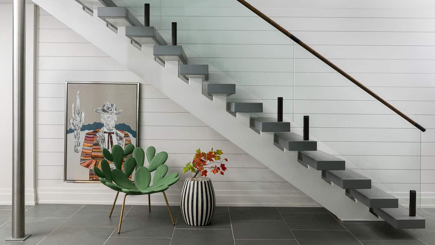 contemporary staircase with a shiplap wall