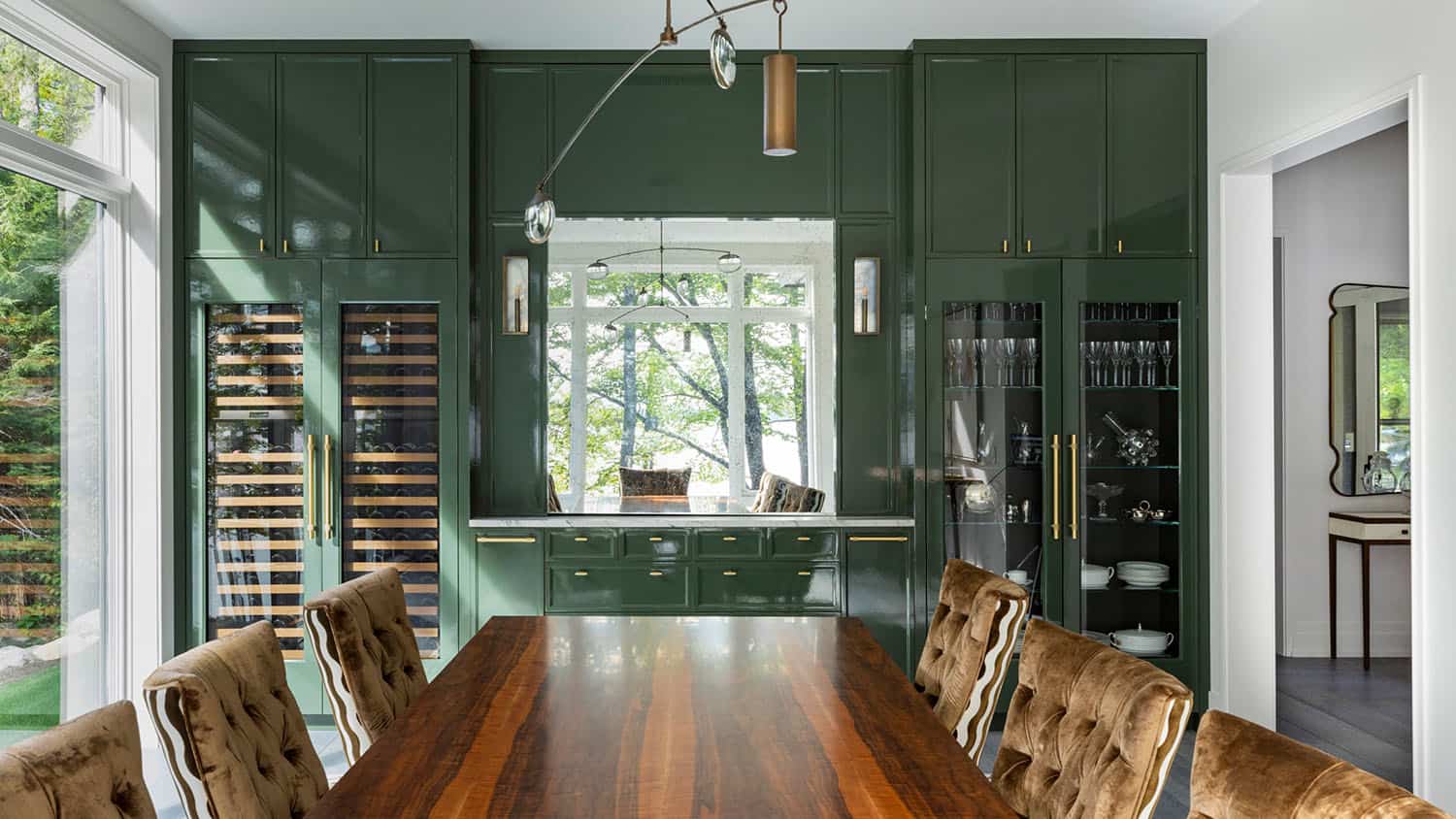 contemporary dining room with green cabinets