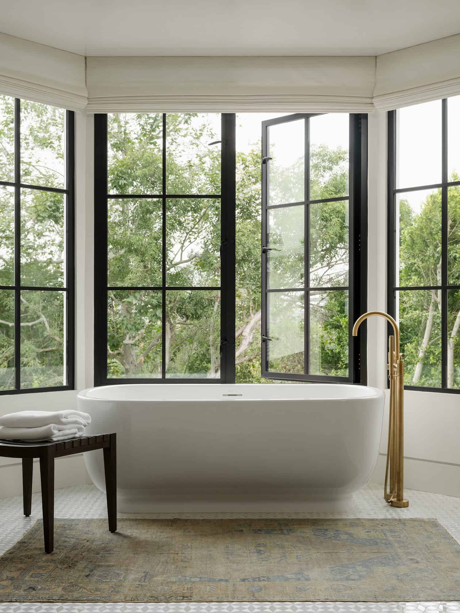 contemporary spanish-style bathroom with a freestanding tub