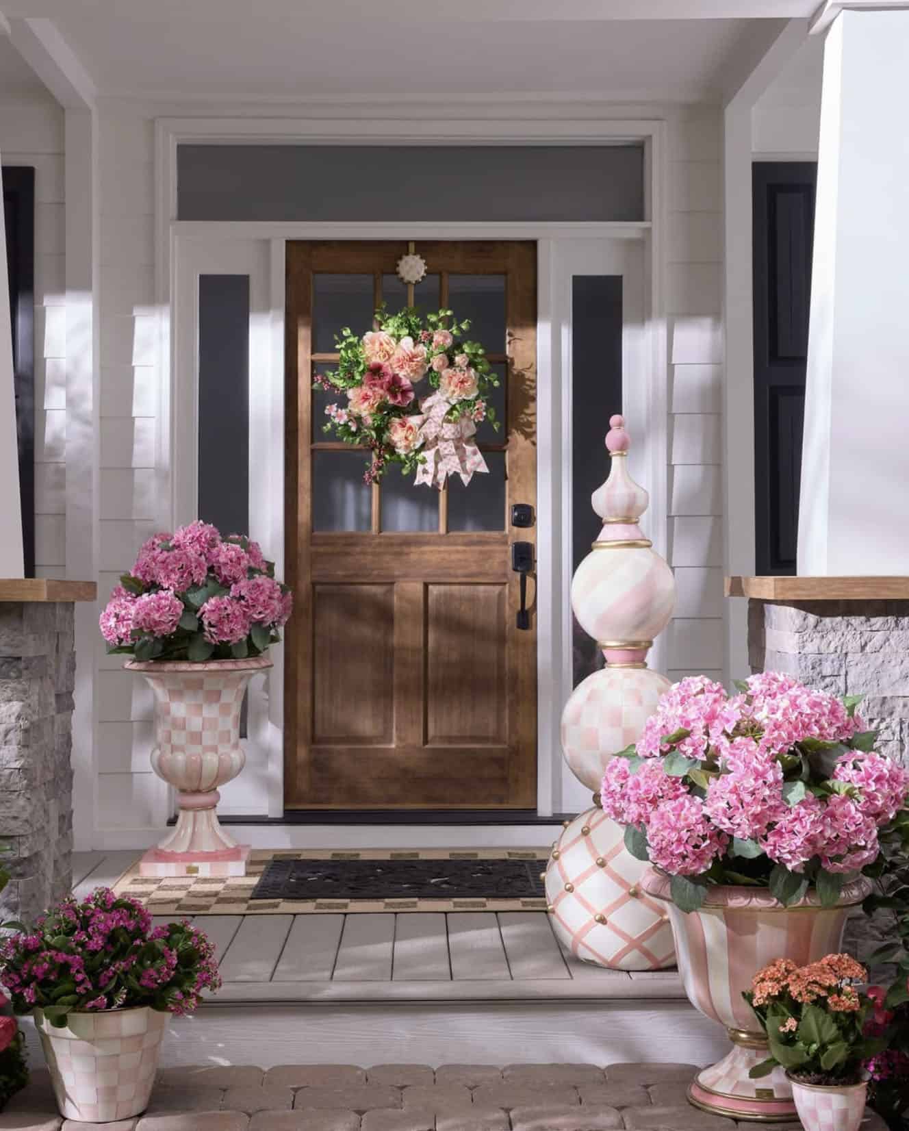 spring front porch decor with urns and door wreaths