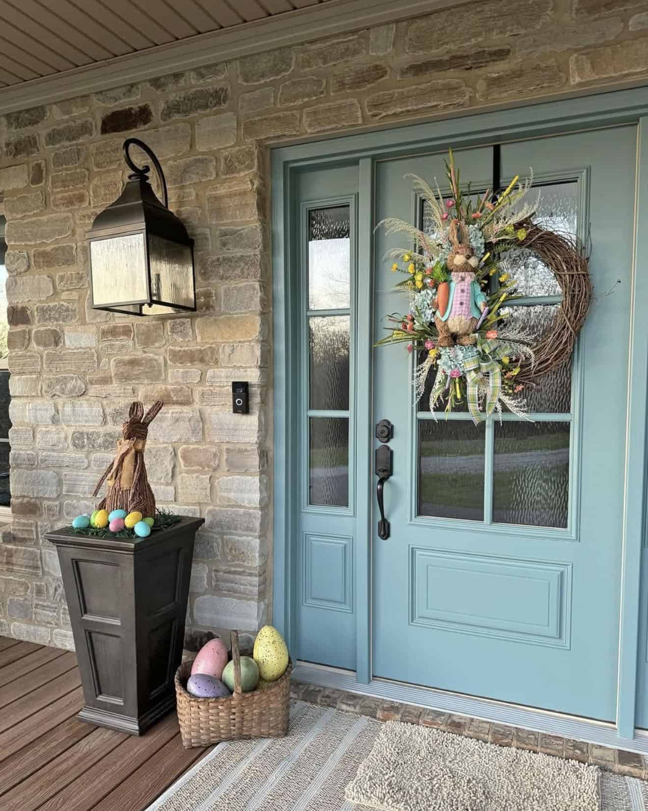 spring front porch decor with a blue door