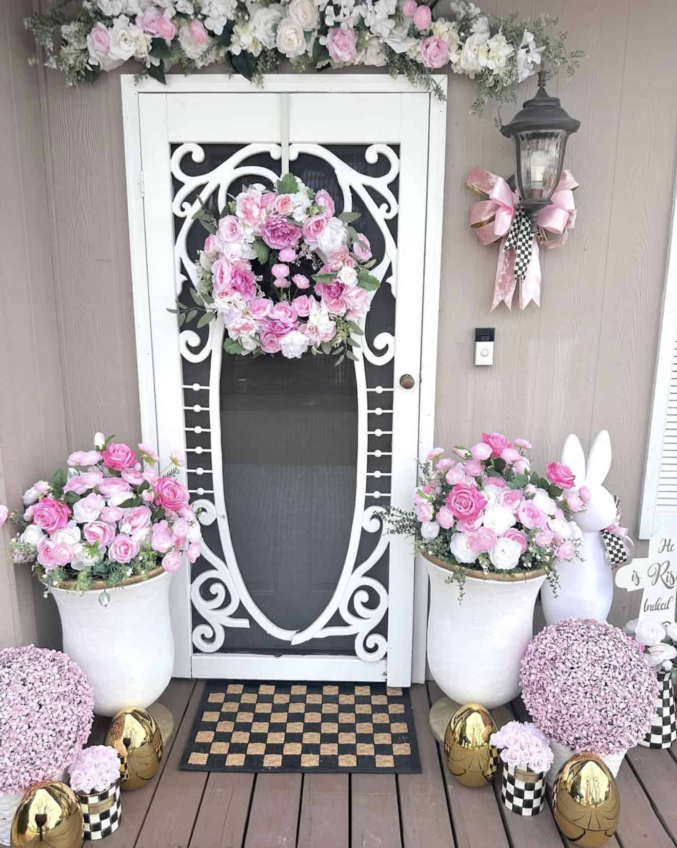 spring front porch decor with a pink and white theme