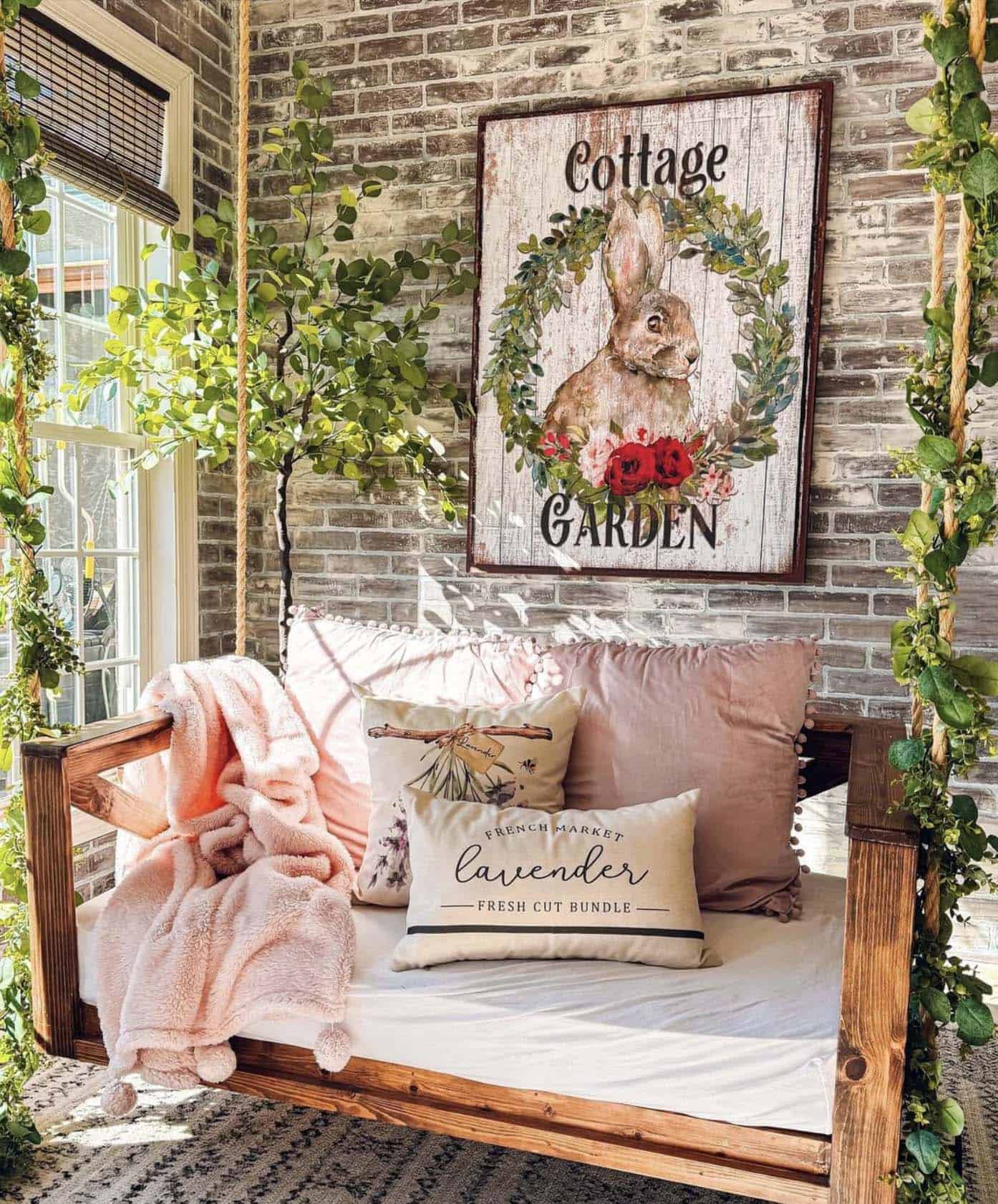 easter decorated front porch with a hanging wood sign