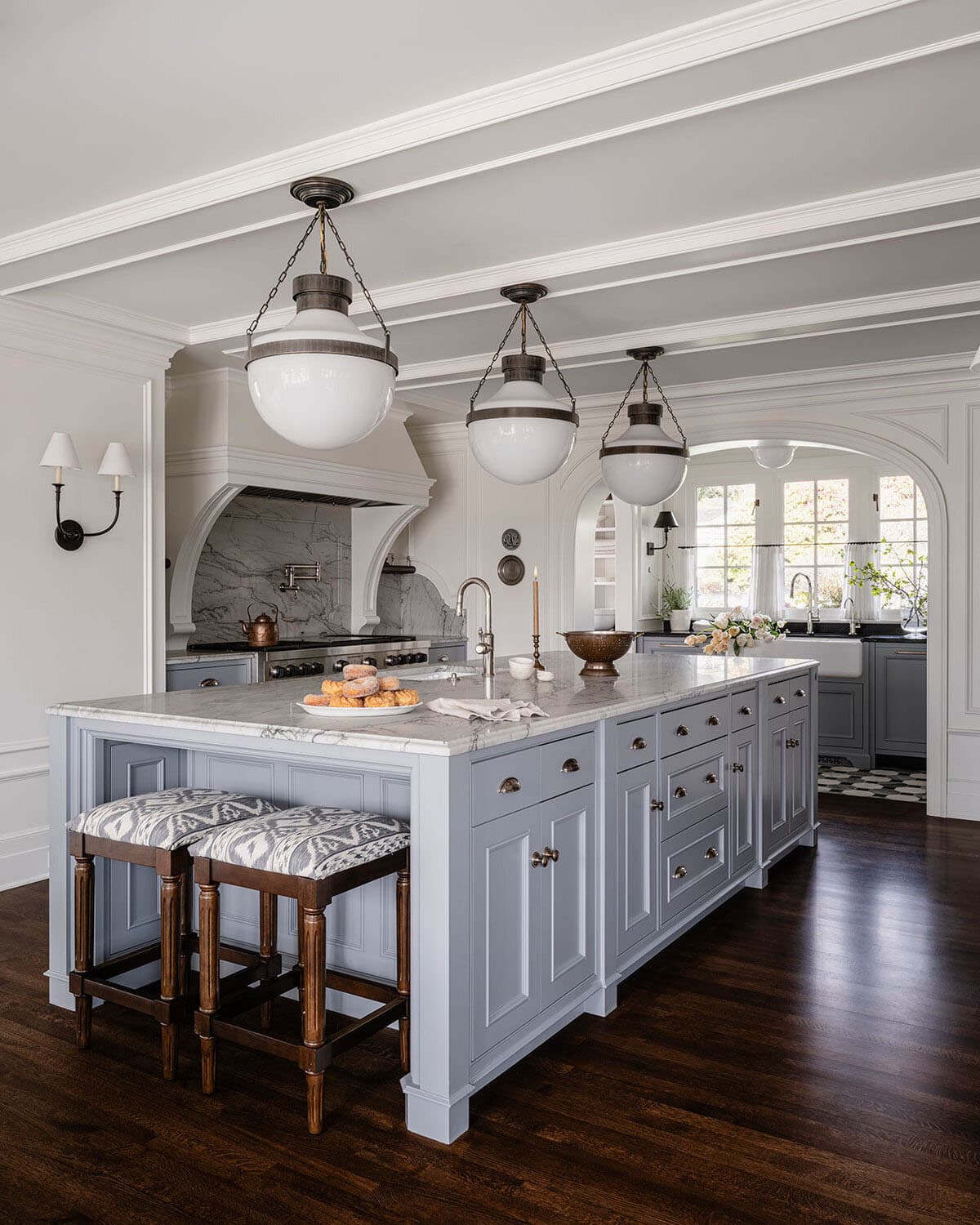 traditional style kitchen with large pendant lights over the island
