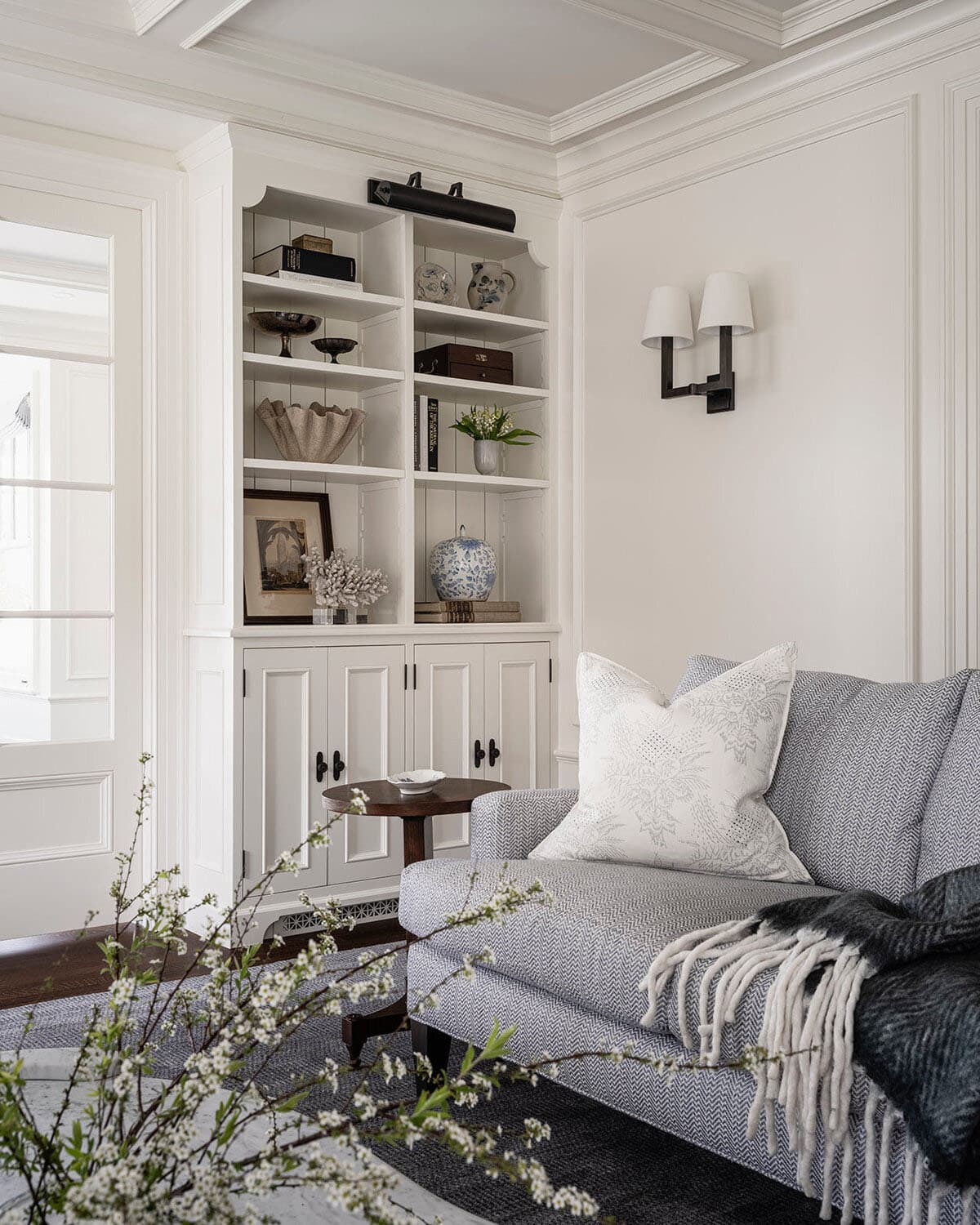 traditional style living room with a built-in cabinet
