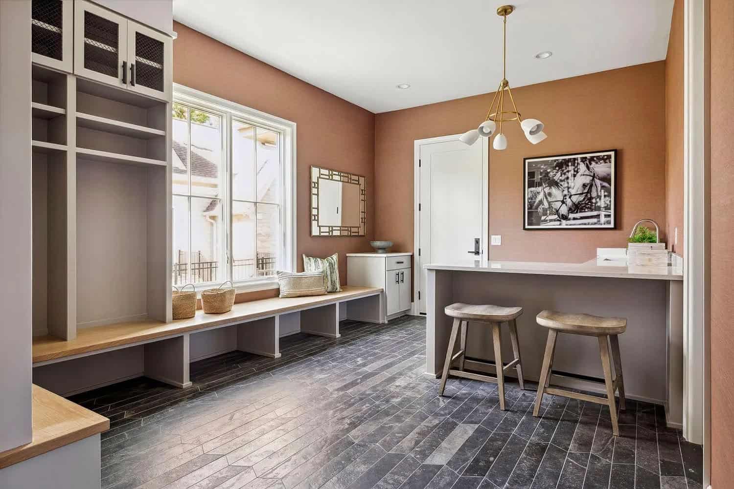 contemporary mudroom with a built-in bench and storage