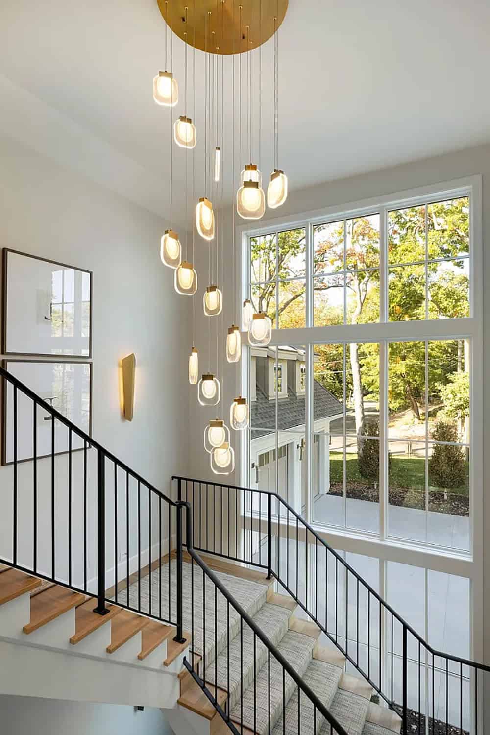 contemporary staircase with hanging lights