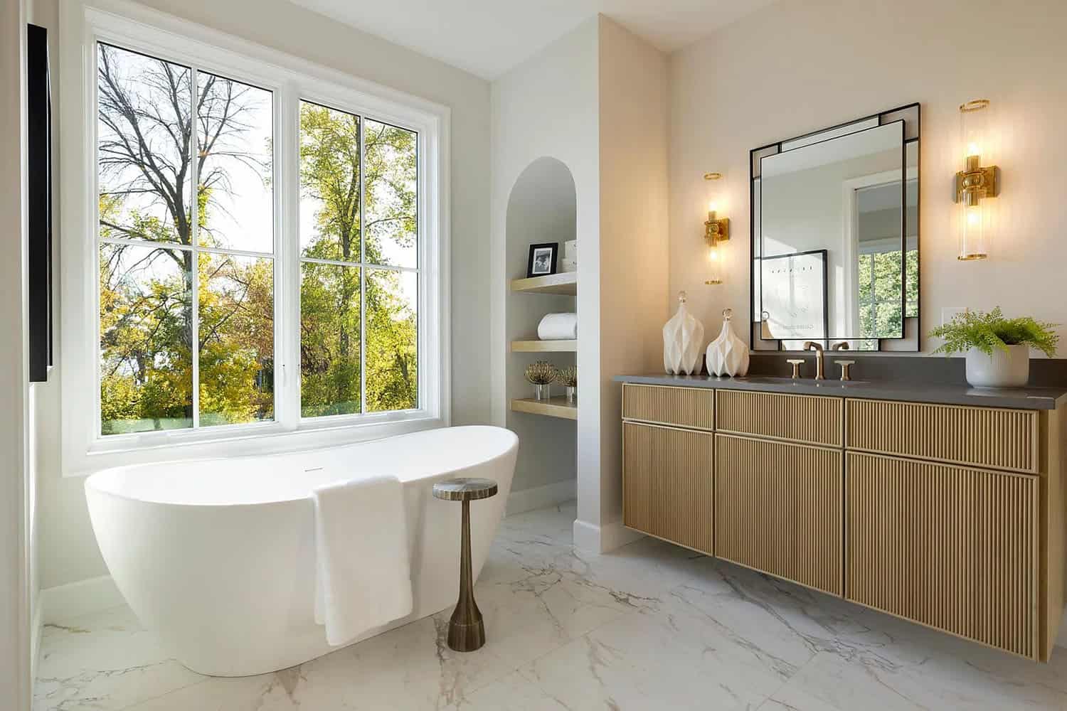 contemporary bathroom with a vanity and freestanding tub