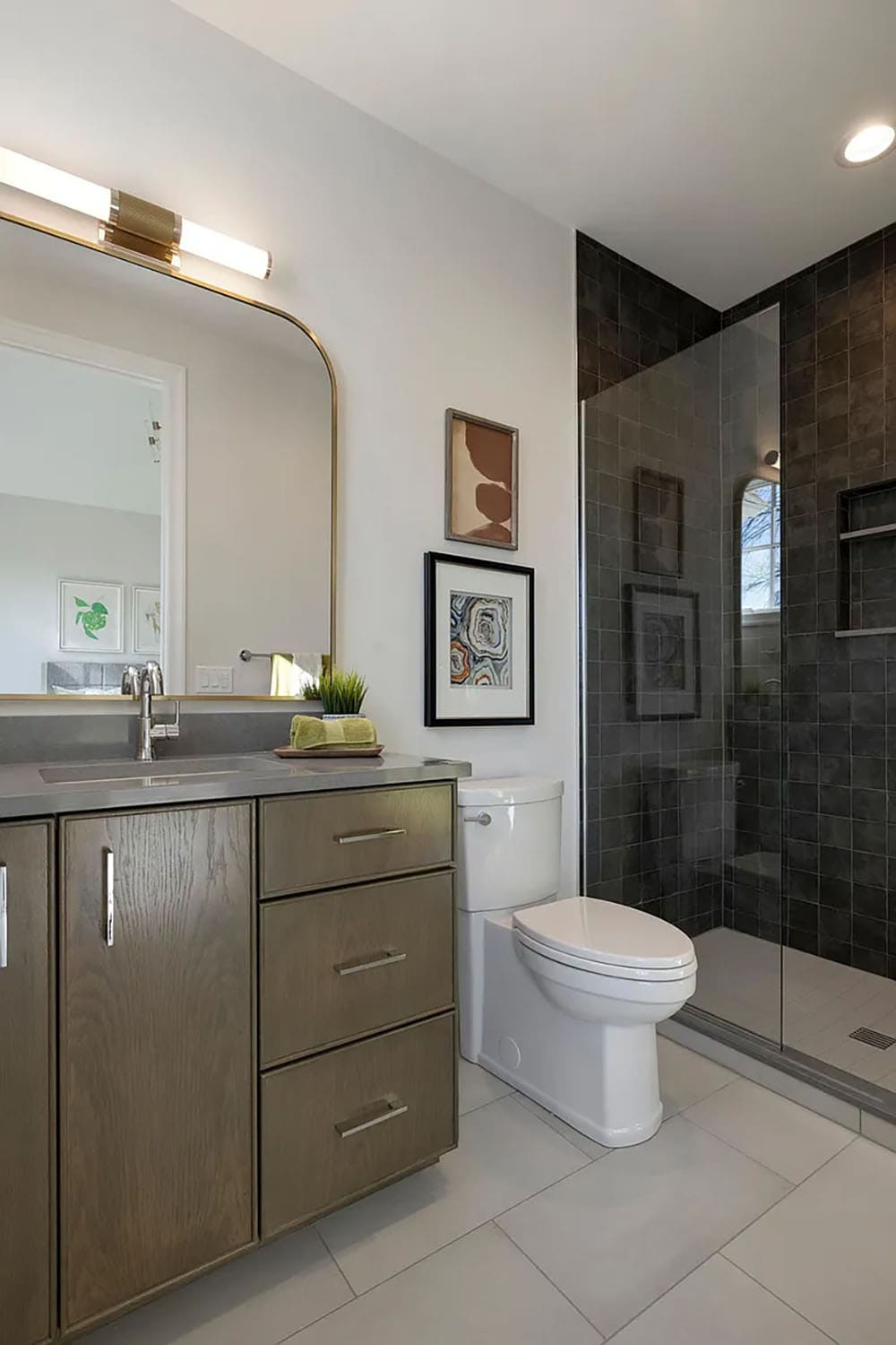 contemporary bathroom with a black tile shower