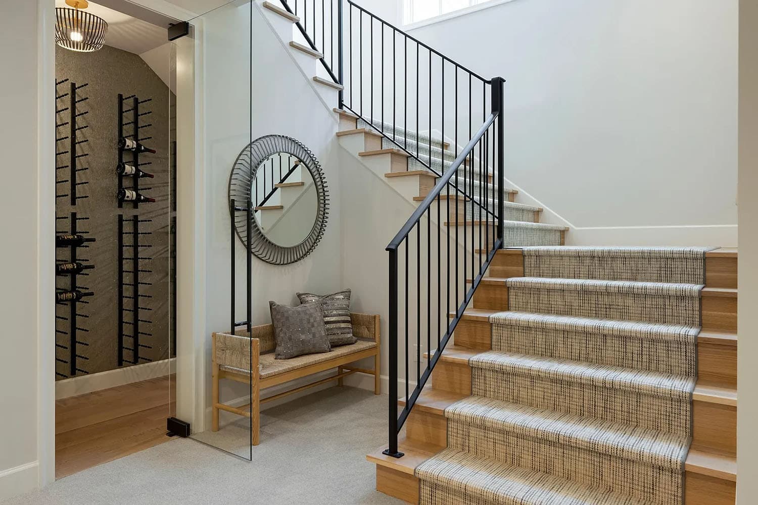 contemporary staircase leading to the lower level with a wine cellar