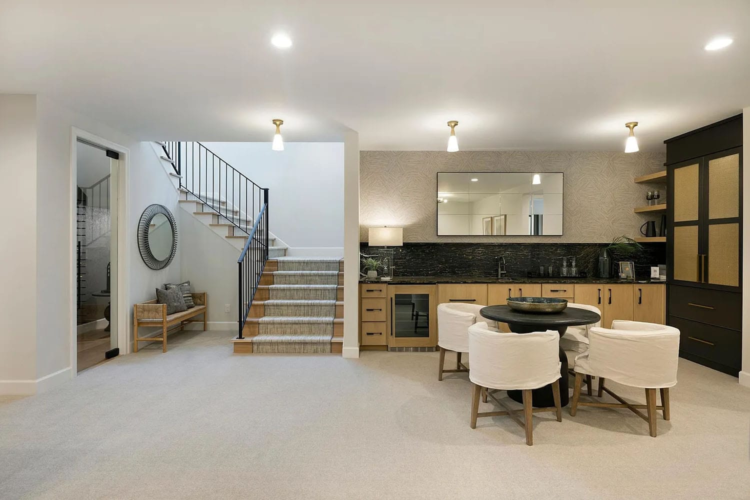 contemporary lower level home bar and sitting area