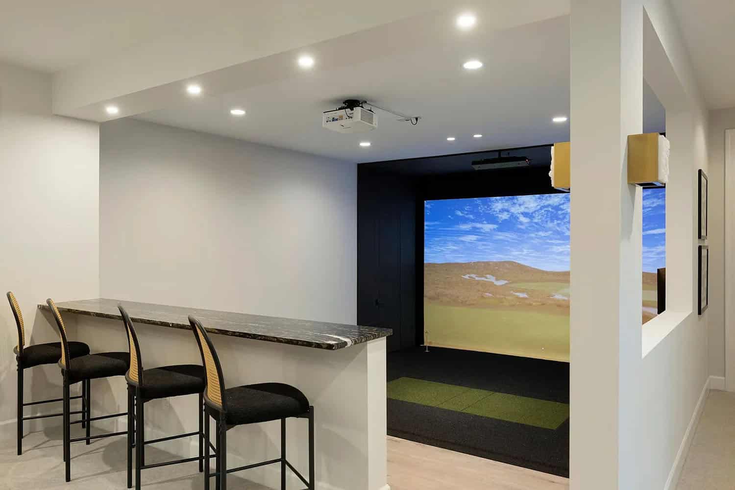 contemporary lower level golf simulator room