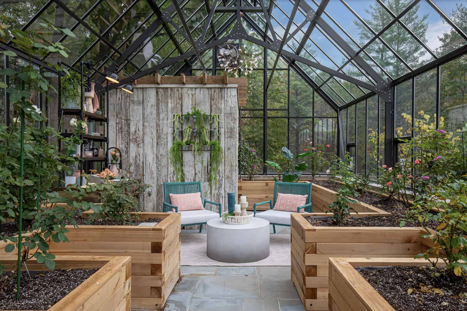 modern glass greenhouse with raised planters