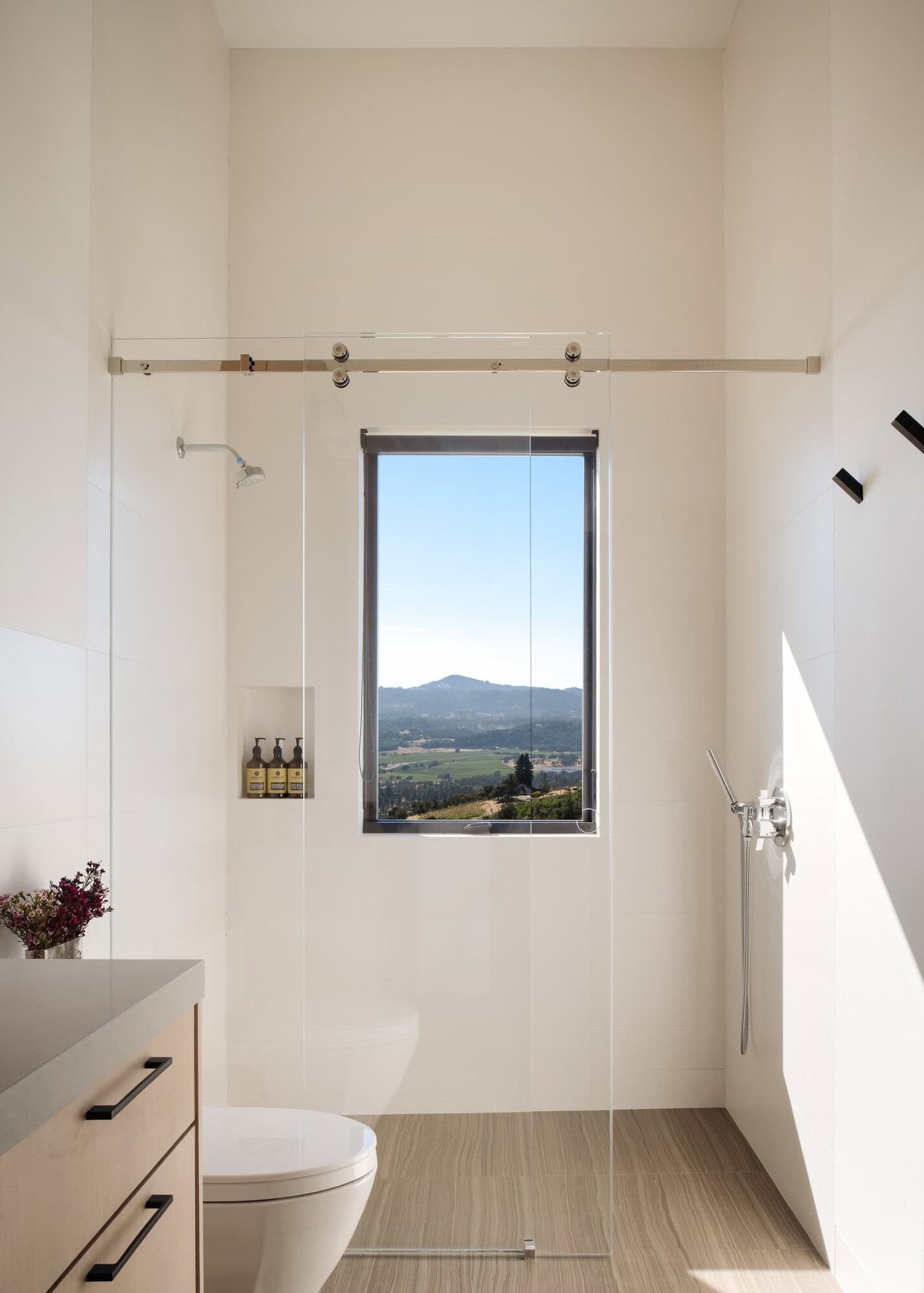 modern bathroom shower with a window