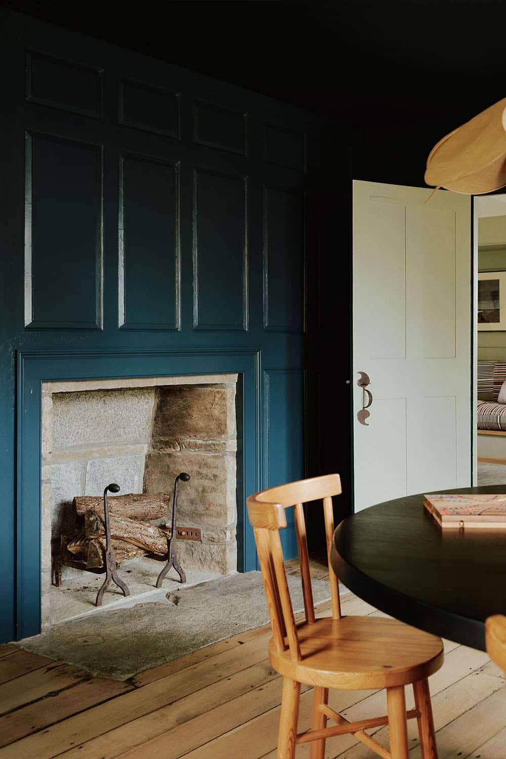 farmhouse style dining room with a fireplace