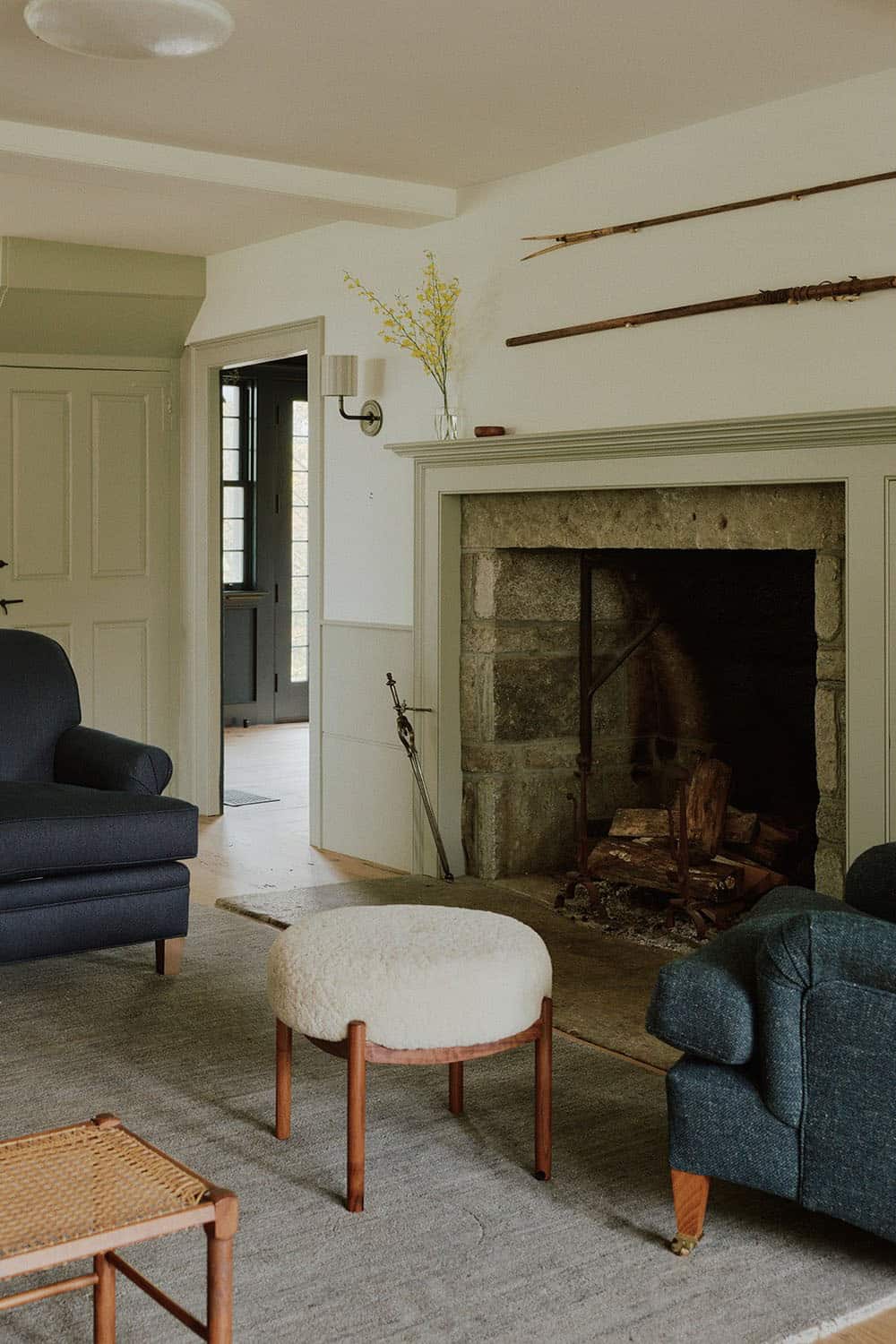 farmhouse style living room with a fireplace