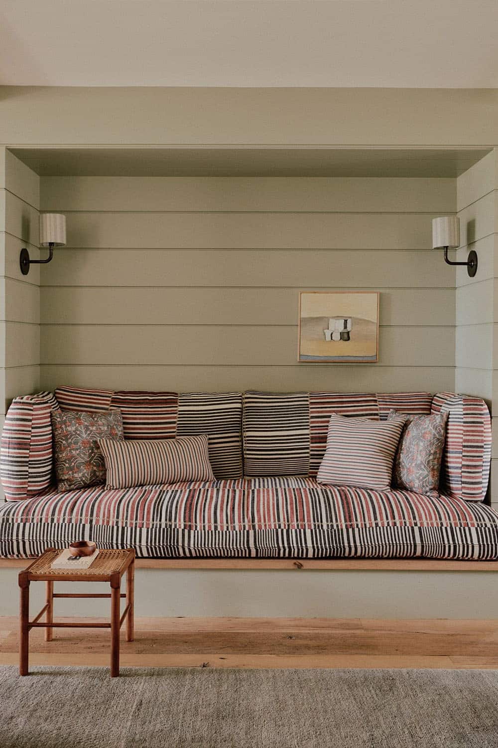 farmhouse style built-in reading nook with wall sconces