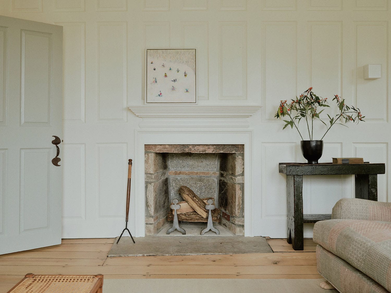 farmhouse style living room with a fireplace