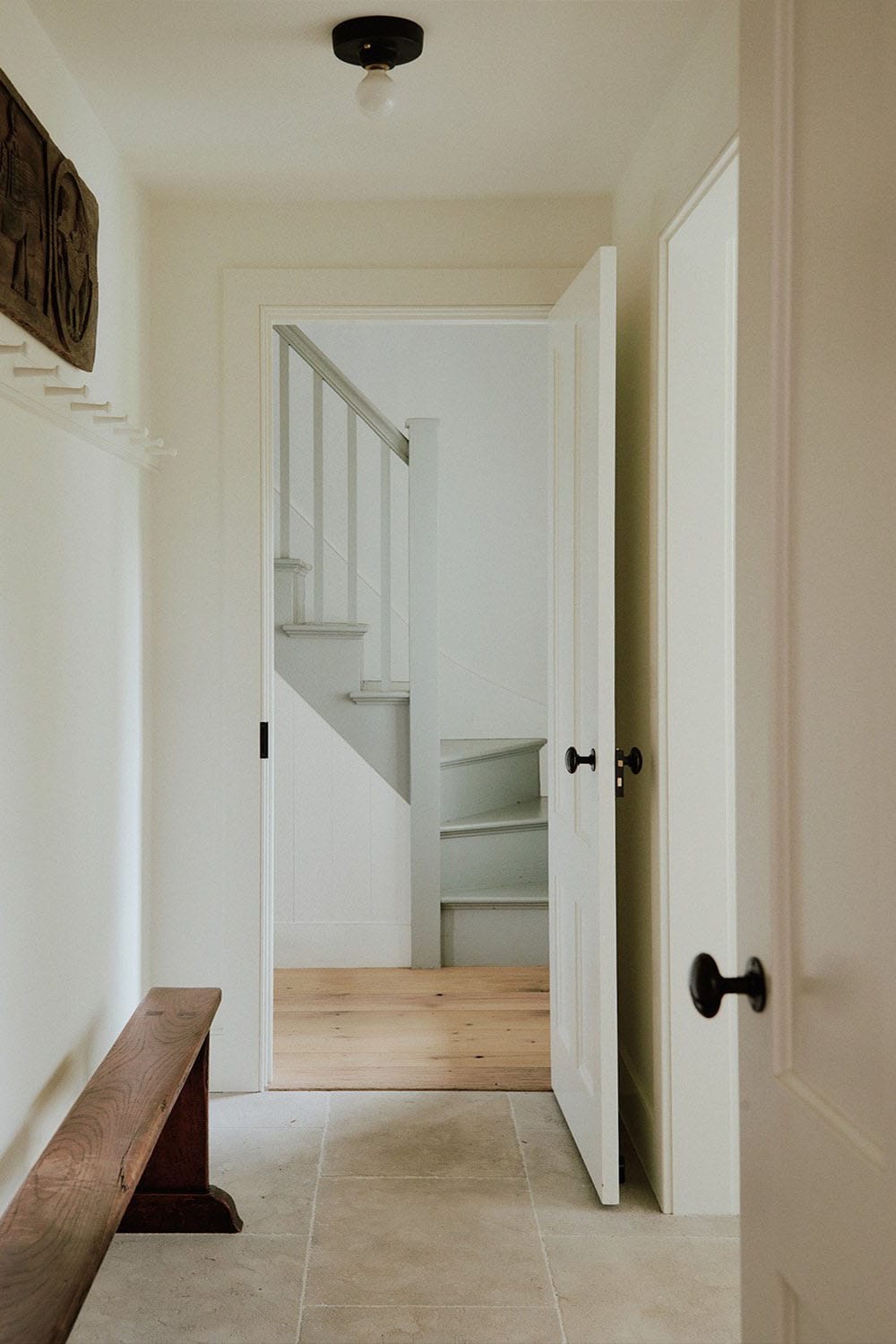 farmhouse style hallway with a bench