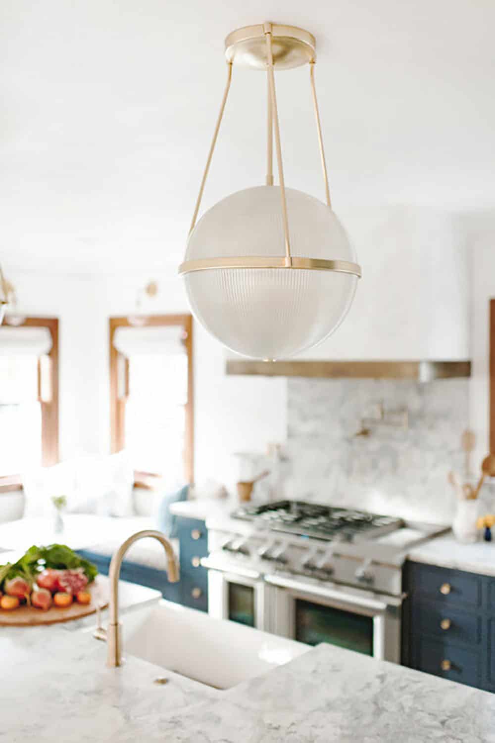 transitional stye kitchen with large pendant lights