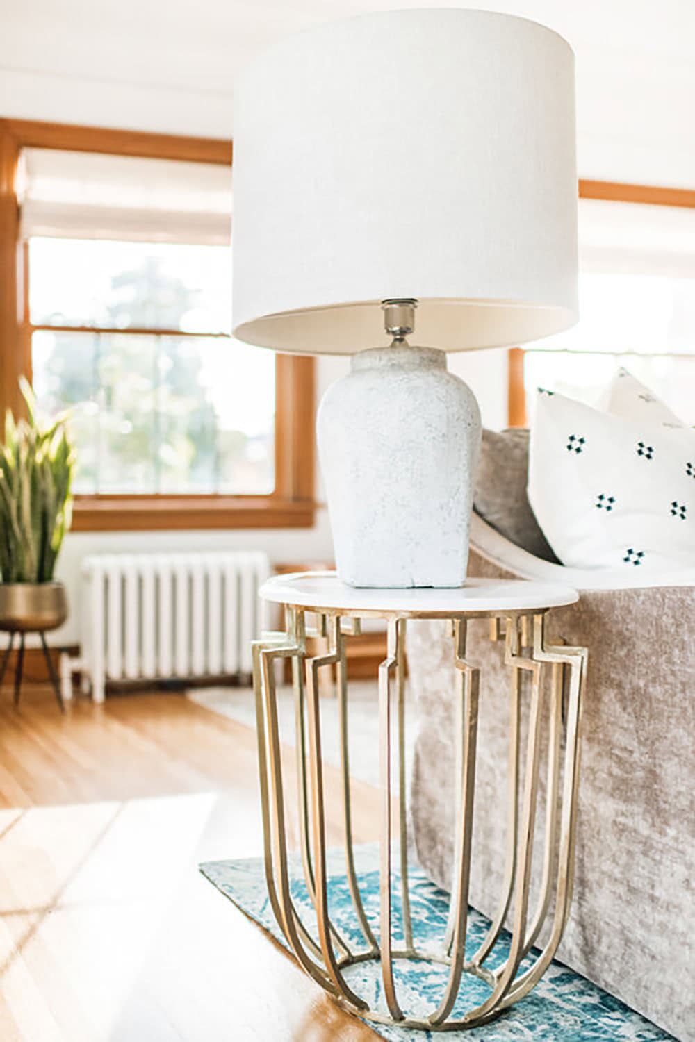 transitional stye living room end table with a lamp