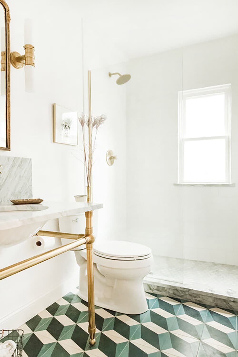 transitional stye bathroom with a vanity and patterned floor tile