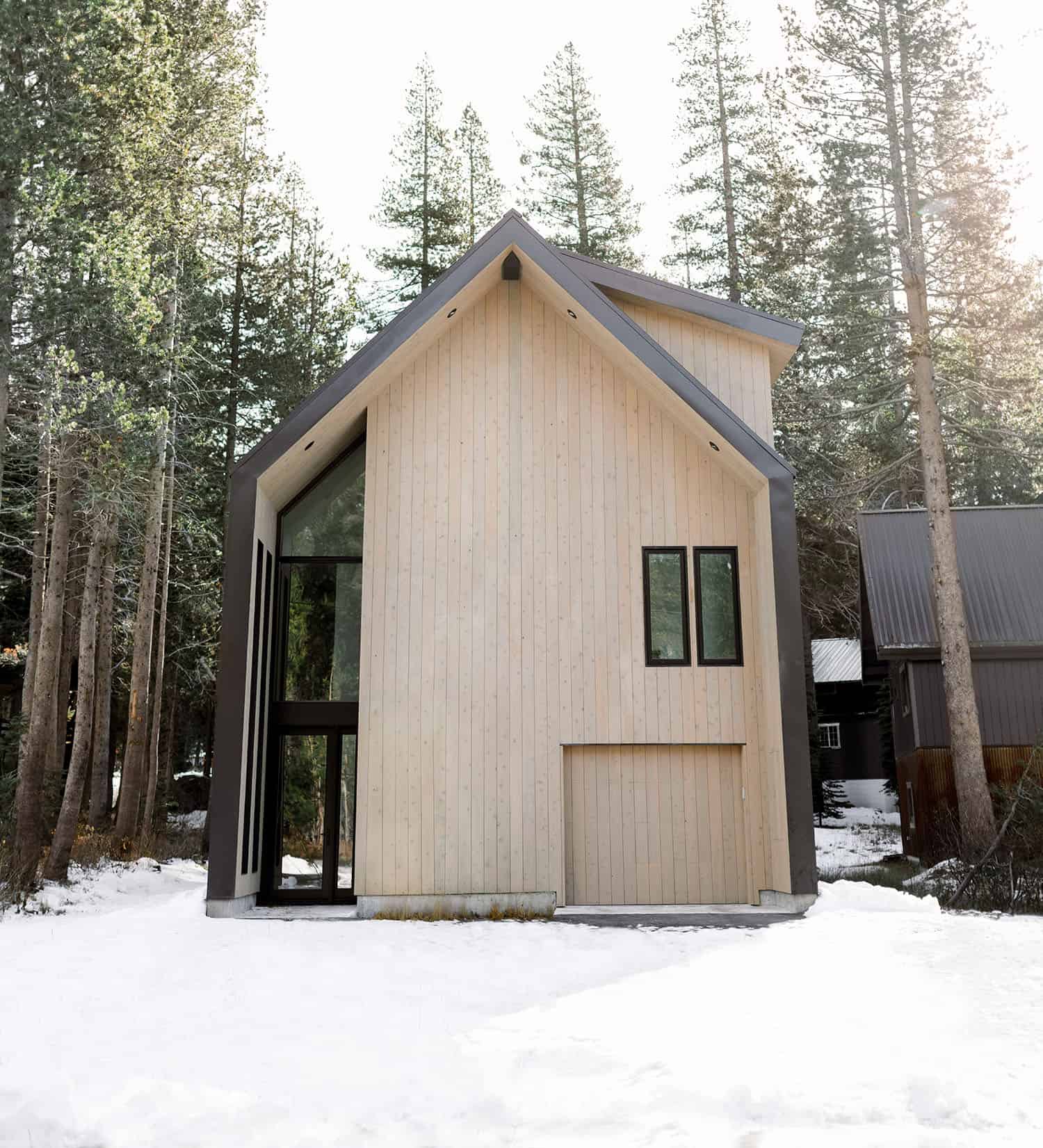 japandi style mountain house exterior with snow