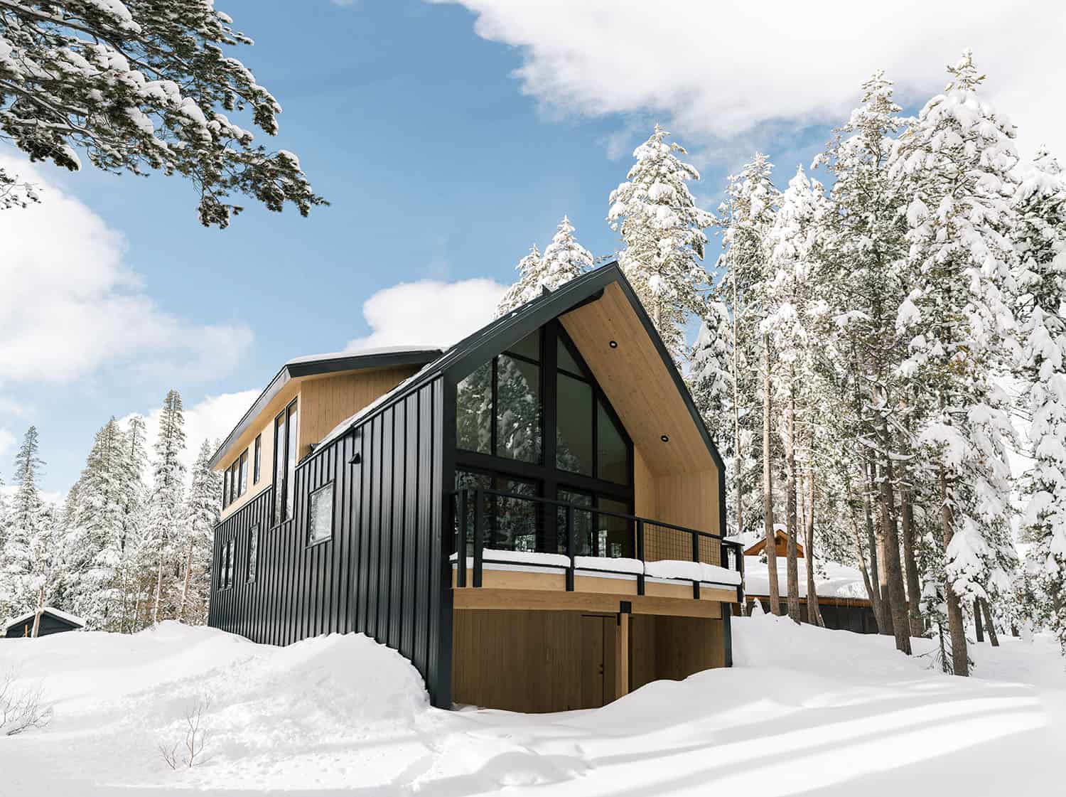japandi style mountain house exterior with snow