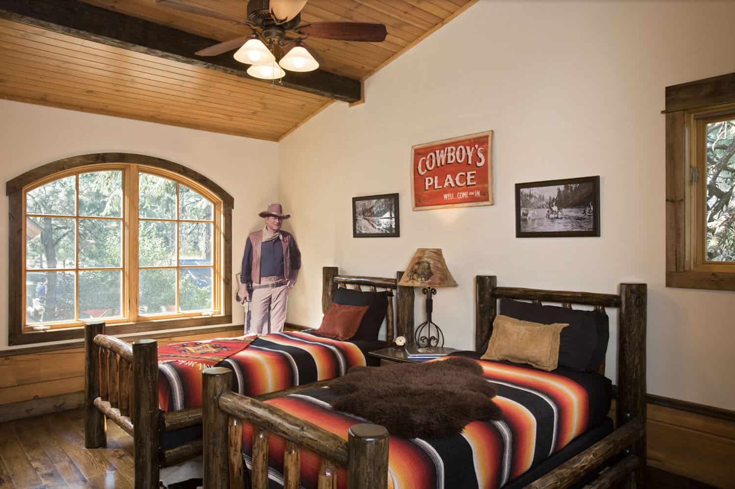 rustic bedroom with two twin wooden beds