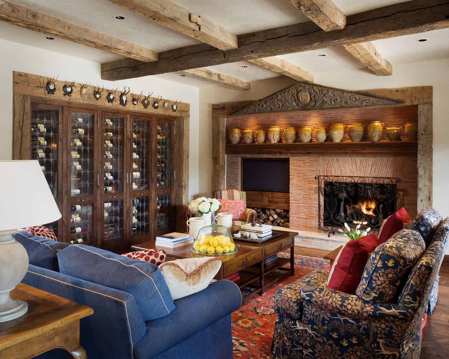 mediterranean style family room with a wine wall and fireplace