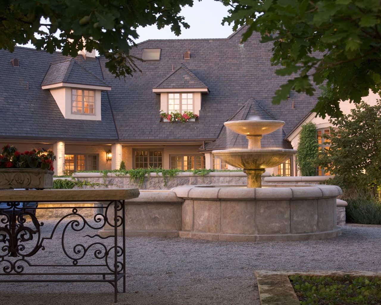 mediterranean style house exterior at dusk